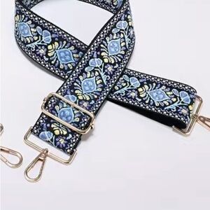 Blue, off white and black purse strap. New. Looks like tapestry t…